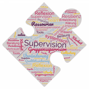 Puzzleteil mit vielen bunten Begriffen zu Supervision